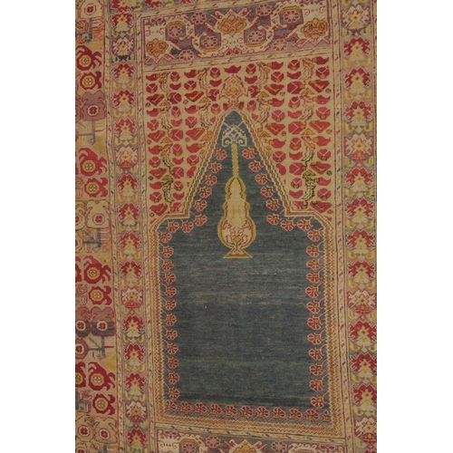 1001 - A PERSIAN PRAYER RUG, beige ground with stylised borders. 5ft 10ins x 4ft 4ins.