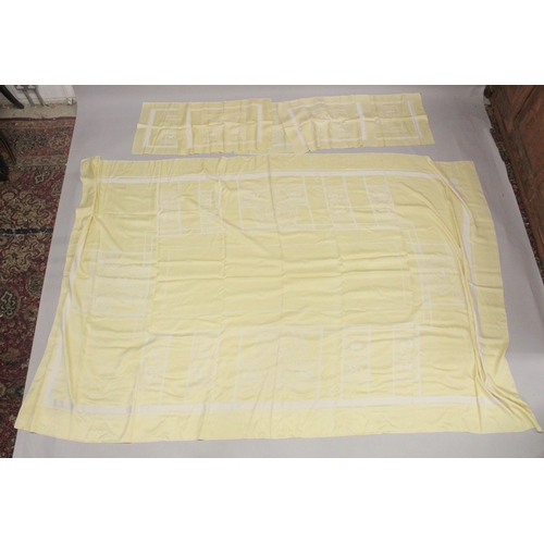 1013 - A YELLOW TABLECLOTH WITH MATCHING NAPKINS.