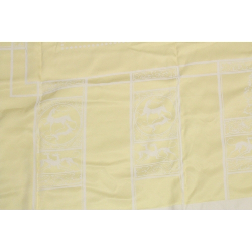 1013 - A YELLOW TABLECLOTH WITH MATCHING NAPKINS.