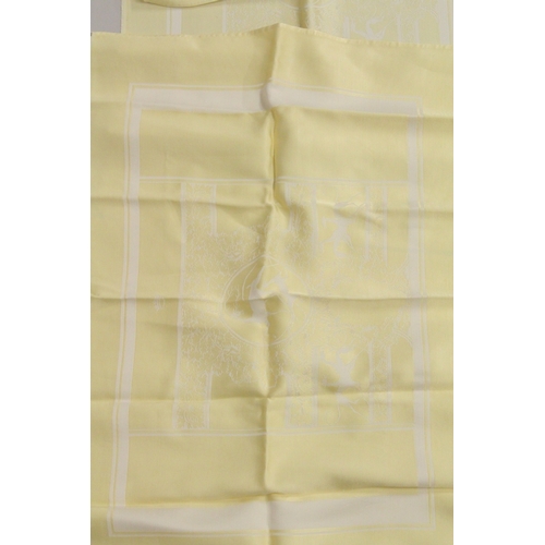 1013 - A YELLOW TABLECLOTH WITH MATCHING NAPKINS.