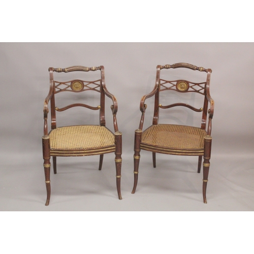 1022 - A GOOD PAIR OF REGENCY THOMAS HOPE DESIGN BLACK JAPANNED AND GILDED ARM CHAIRS with rope back, lion ... 