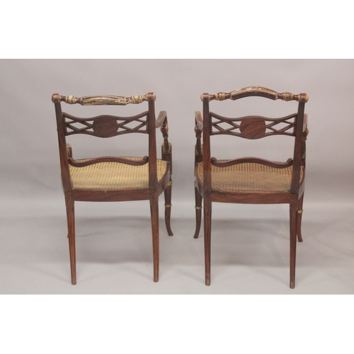 1022 - A GOOD PAIR OF REGENCY THOMAS HOPE DESIGN BLACK JAPANNED AND GILDED ARM CHAIRS with rope back, lion ... 