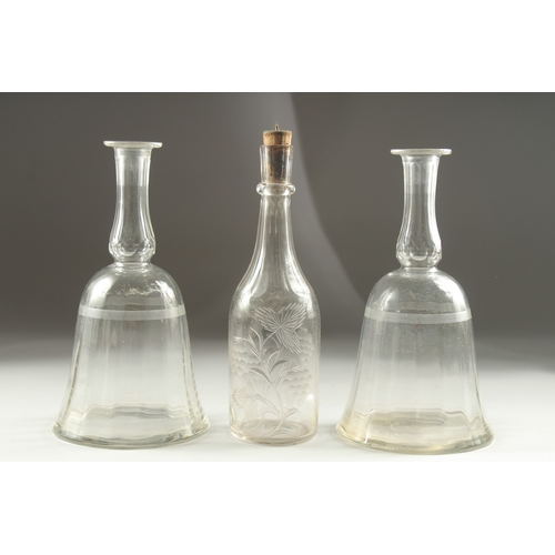 1041A - A PAIR OF GEORGIAN BELL SHAPE DECANTERS (no stoppers) and an engraved decanter (3).