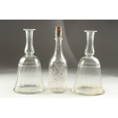 1041A - A PAIR OF GEORGIAN BELL SHAPE DECANTERS (no stoppers) and an engraved decanter (3).