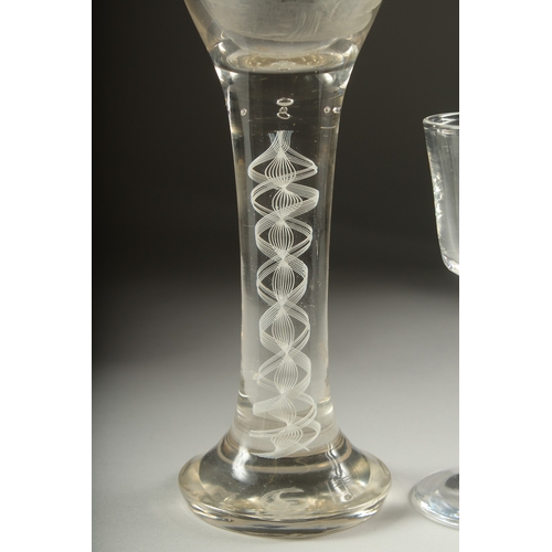 1050A - A LARGE OPAQUE TWIST WINE GLASS, the bowl engraved with a sporting dog .9ins high and a small wine g... 