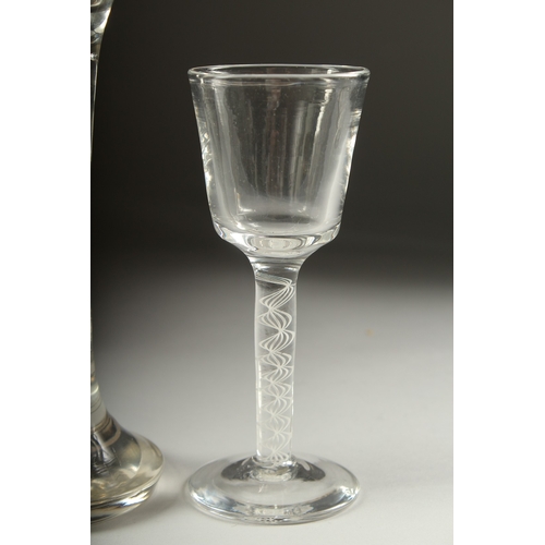 1050A - A LARGE OPAQUE TWIST WINE GLASS, the bowl engraved with a sporting dog .9ins high and a small wine g... 