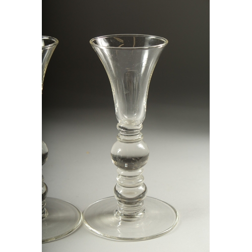 1050B - A SET OF FOUR PLAIN KNOP STEM WINE GLASSES. 7ins high.