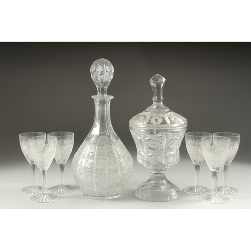 1050C - A GOOD CUT GLASS SHERRY DECANTER AND STOPPER, SIX GLASSES AND BOWL AND COVER.(8).