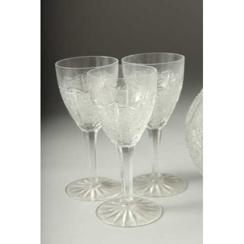 1050C - A GOOD CUT GLASS SHERRY DECANTER AND STOPPER, SIX GLASSES AND BOWL AND COVER.(8).