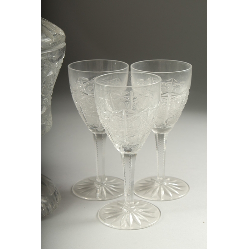 1050C - A GOOD CUT GLASS SHERRY DECANTER AND STOPPER, SIX GLASSES AND BOWL AND COVER.(8).