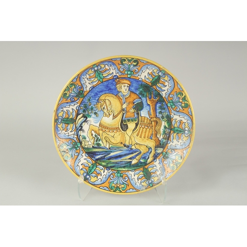 1060 - A CANTAGALLI ITALIAN POTTERY CIRCULAR CHARGER, the centre with a man on horseback. 14ins diameter, C... 