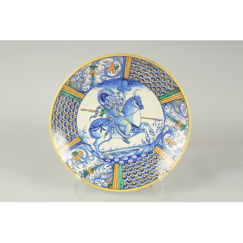 1061 - A CANTAGALLI ITALIAN POTTERY CIRCULAR CHARGER.  The centre with a man on horseback in blue. 14ins di... 