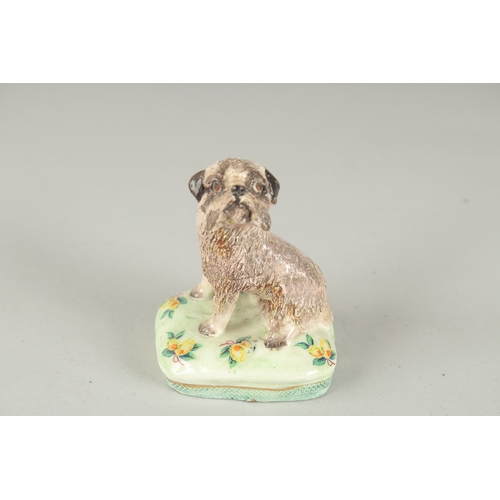 1065 - BASIL MATHEWS. A POTTERY DOG, signed. 2.75ins high.