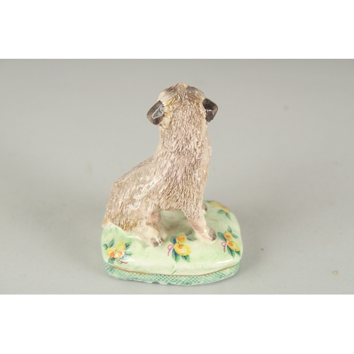 1065 - BASIL MATHEWS. A POTTERY DOG, signed. 2.75ins high.