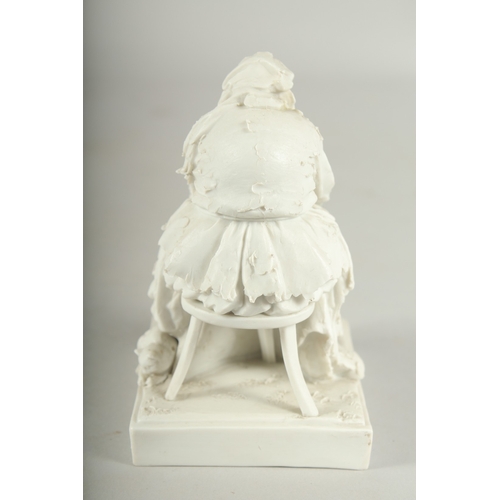 1072 - A PARIAN MODEL OF A YOUNG LADY with a cat.  4.5ins high.