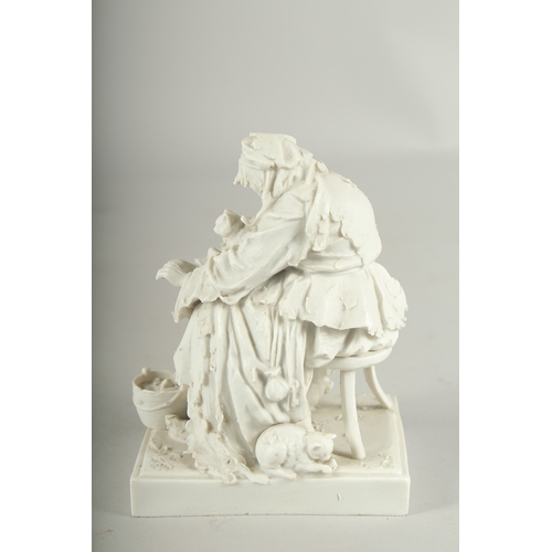 1072 - A PARIAN MODEL OF A YOUNG LADY with a cat.  4.5ins high.