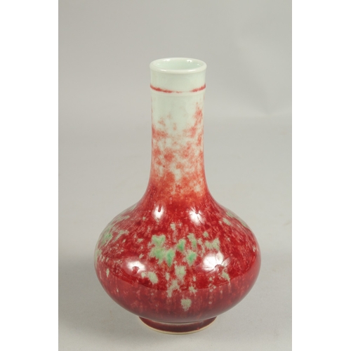 1084 - A CHINESE SPLASH RED BOTTLE VASE, six character mark.  7ins high.