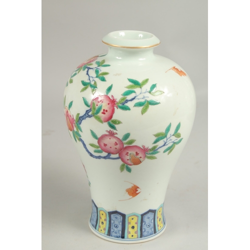 1085 - A CHINESE VASE PAINTED WITH FLOWERING TREES DESIGN. Six character mark.  8.5ins high.