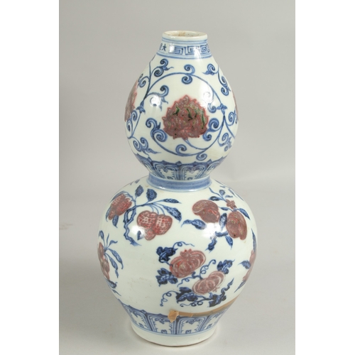 1087 - A CHINESE DOUBLE GOURD VASE painted with fruit.  12ins high.