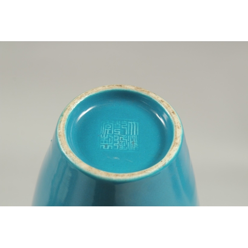 1089 - A CHINESE BLUE VASE with a stork in relief, impressed mark.  8ins high.