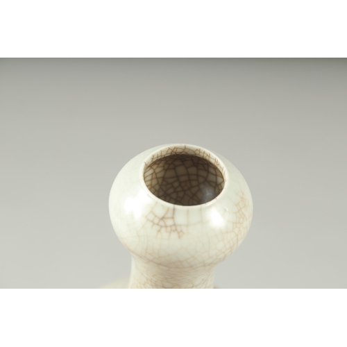 1094 - A SMALL CHINESE CRACKLE GLAZE VASE.  6.5ins high.