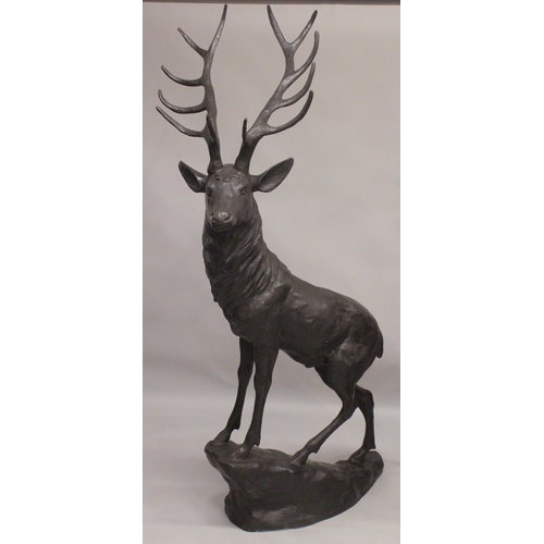 1109 - AFTER JULES MOIGNIEZ. A GOOD MASSIVE PAIR OF BRONZE STAGS on rocky bases. 6ft 3ins high.