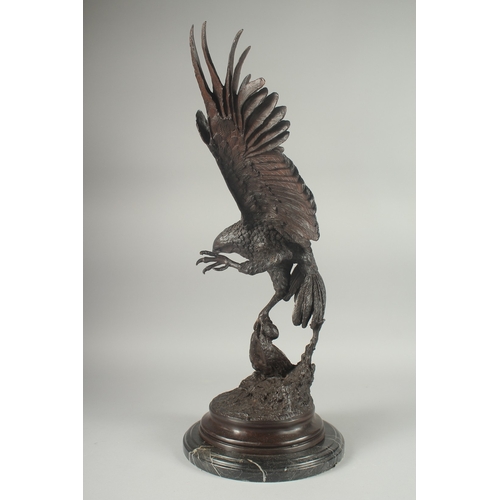 1111 - JULES MOIGNEZ (1815 - 1894). A SUPERB BRONZE OF AN EAGLE, WINGS OUTSTRETCHED with prey in it's claw.... 