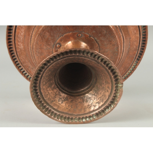 1147 - A TURKISH HAMMERED COPPER TAZZA. 11ins diameter, 6.5ins high.