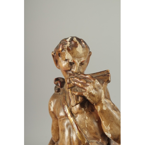 1165 - A GOOD PAIR OF 17TH - 18TH CENTURY CARVED AND POLYCHROMED WOOD FIGURES. A man playing a pan pipe and... 