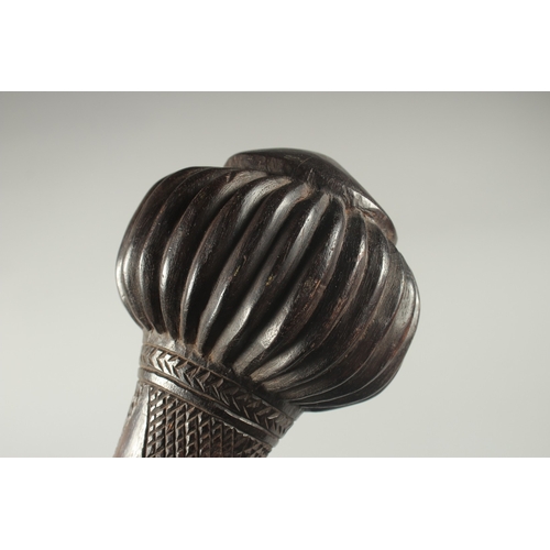 1168 - A GOOD HEAVY FIJIAN THROWING CLUB with carved decoration. 18.5ins long, 16ins long, 4.5ins diameter.... 