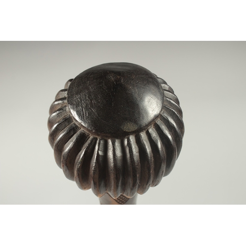 1168 - A GOOD HEAVY FIJIAN THROWING CLUB with carved decoration. 18.5ins long, 16ins long, 4.5ins diameter.... 