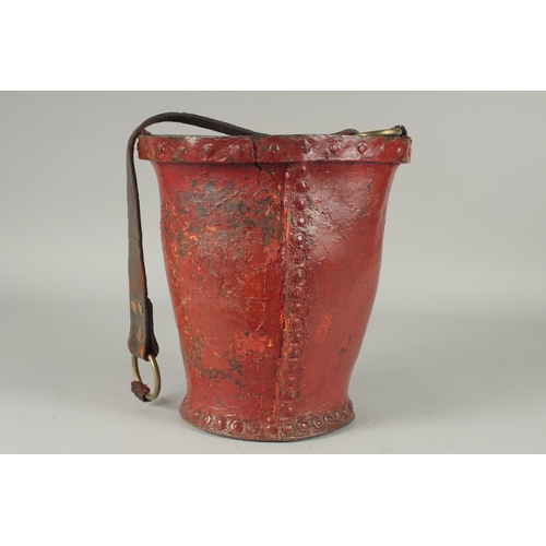 1171 - AN EARLY LEATHER METAL BOUND FIRE BUCKET with Royal Crest. 11ins high.