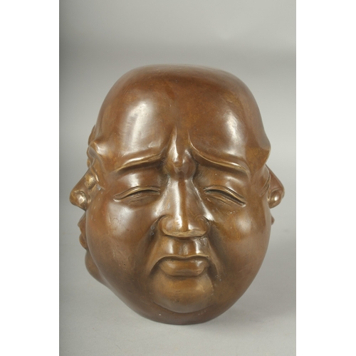 1196 - A BRONZE FOUR FACED BUDDHA. 8ins high.