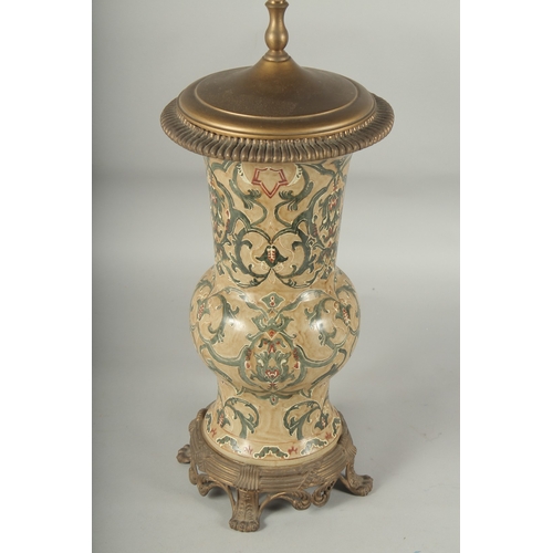 1217 - A GREEN PORCELAIN LAMP on claw feet. Vase: 14ins high.