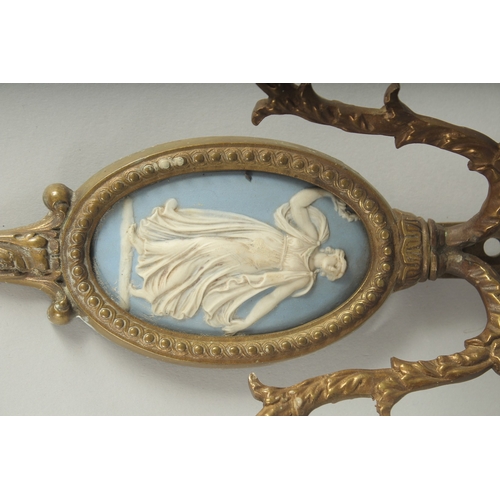 1230 - A PAIR OF GILT METAL TWO LIGHT WALL SCONCES with oval  Wedgwood Jasper plaques. 14ins long.