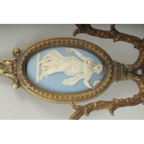 1230 - A PAIR OF GILT METAL TWO LIGHT WALL SCONCES with oval  Wedgwood Jasper plaques. 14ins long.