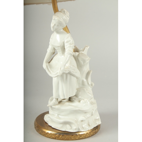 1239 - A WHITE PORCELAIN YOUNG LADY LAMP with a shade.