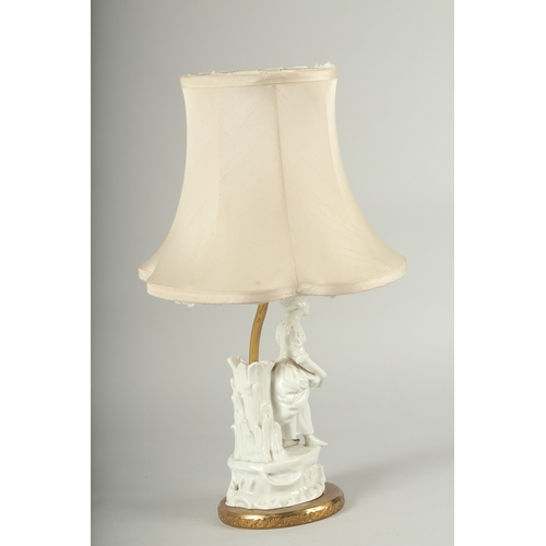 1239 - A WHITE PORCELAIN YOUNG LADY LAMP with a shade.