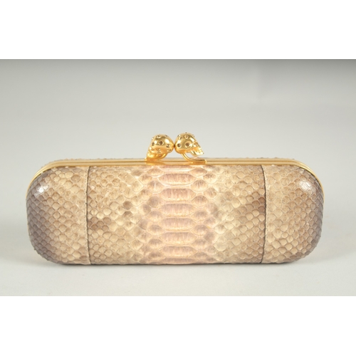 1249 - ALEXANDER MCQUEEN.  A SNAKESKIN CLUTCH BAG.  9ins long.