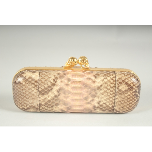 1249 - ALEXANDER MCQUEEN.  A SNAKESKIN CLUTCH BAG.  9ins long.