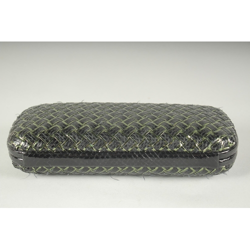 1251 - BOTTEGA VENETO. A BLACK AND GILT WOVEN CLUTCH BAG.  9.5ins long.