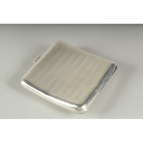 1281 - AN ENGINE TURNED SILVER CIGARETTE CASE. Birmingham 1922, 87gms, with an oval enamel nude.