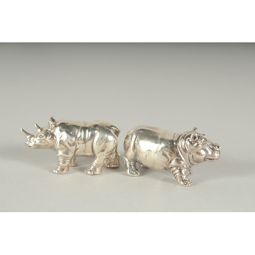 1294 - A PAIR OF SILVER HIPPO AND RHINOS.