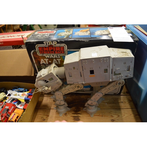 103 - A Star Wars At-At toy with box and two other boxed Transformer toys.