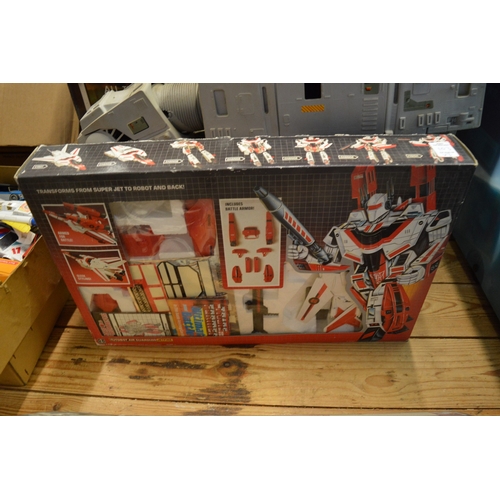 103 - A Star Wars At-At toy with box and two other boxed Transformer toys.