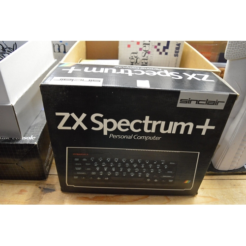 104 - A Spectrum ZX personal computer, boxed, a Sega computer game console with accessories and other rela... 