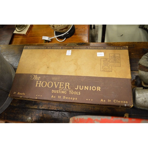 144 - An old Hoover Junior vacuum cleaner with original boxed accessories.