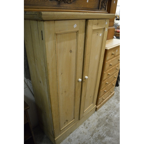 194 - A pine two door cupboard.