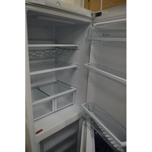 204 - A Hotpoint upright fridge freezer.