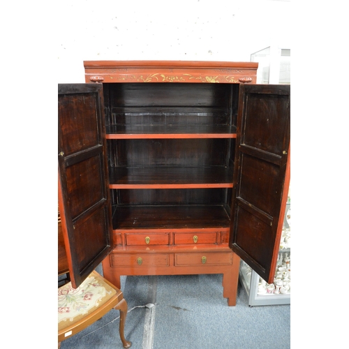 215 - A Chinese red lacquer and brass mounted wardrobe or storage cabinet.